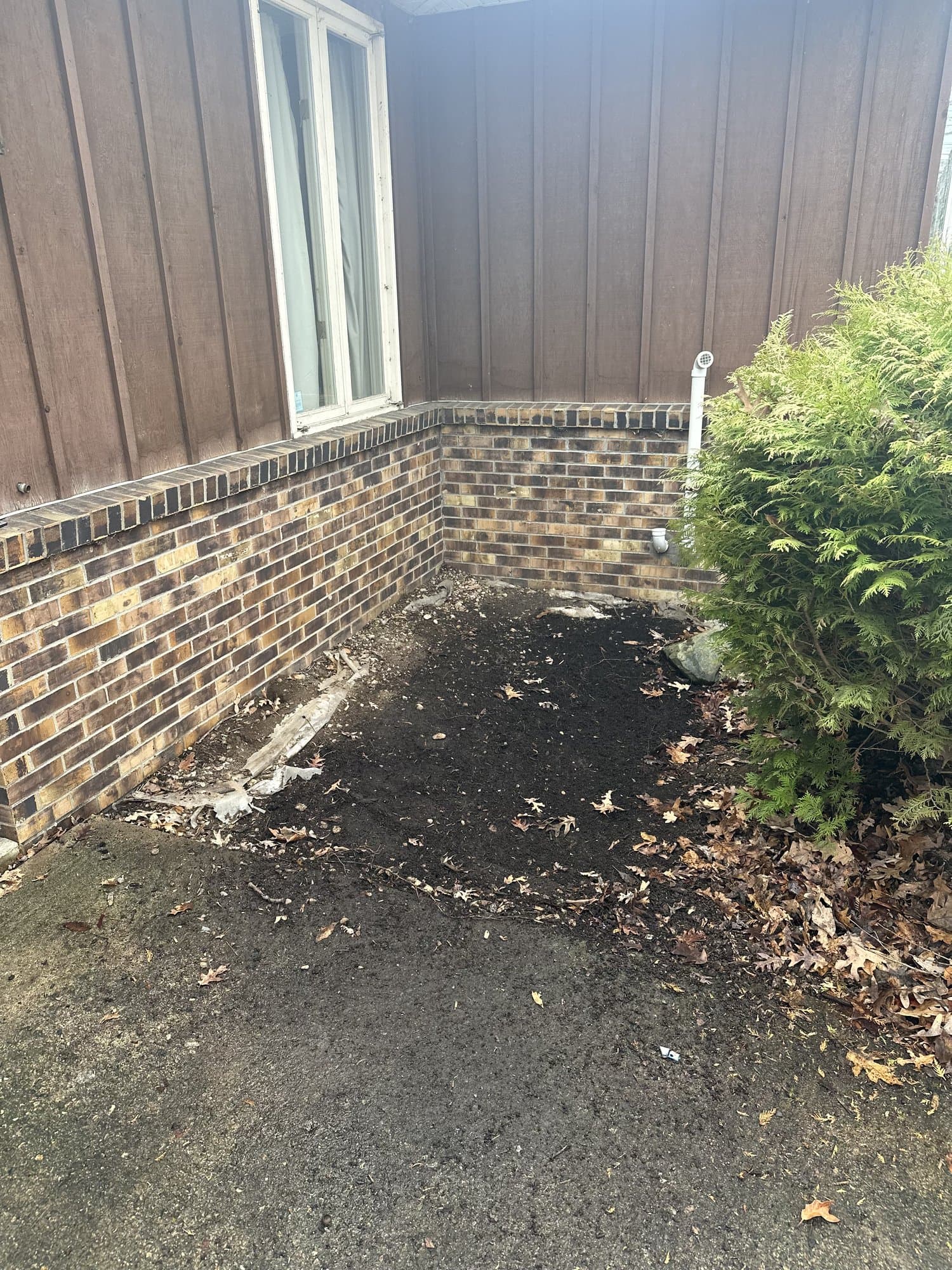 Same brick exterior, fully cleared after the cleanout